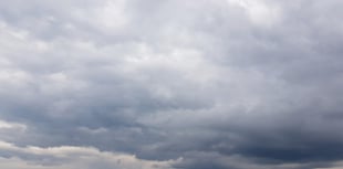 Mild day with partly cloudy skies and a chance of rain tomorrow