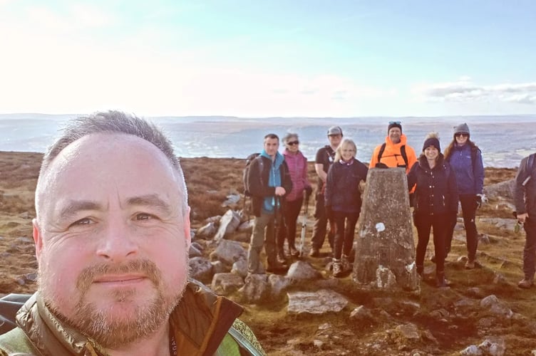 Simon and people at the walking group at one of their locations. 