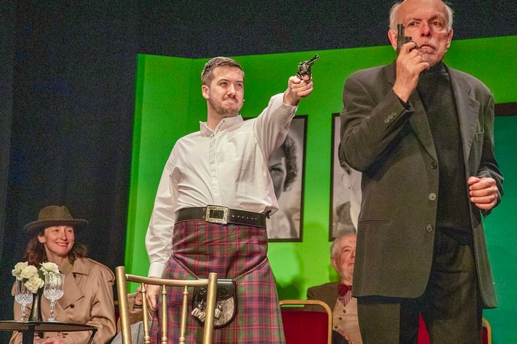 Tartan agent Jock (Matthew Bryant) takes aim