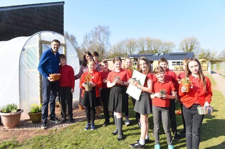 Adam given a token of appreciation for his help at Trellech School
