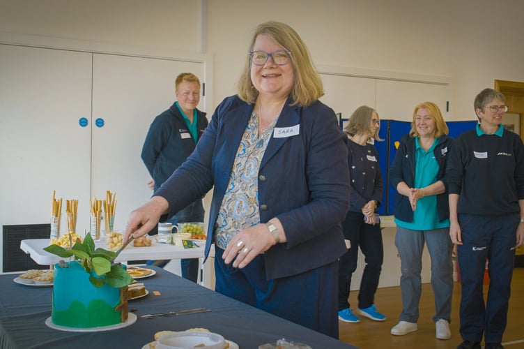 Cabinet Member for Rural Affairs, Housing and Tourism, Cllr Sarah Burch cuts the celebration cake