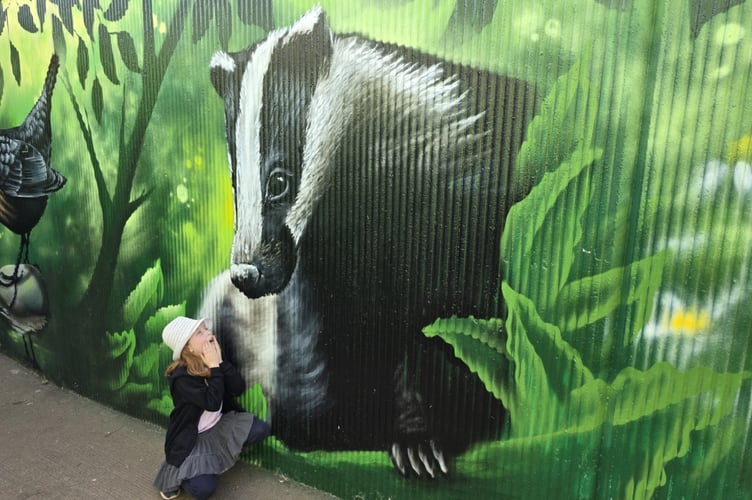 Saffron admires the badger, part of the underpass ural