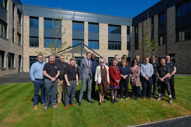Leader Mary Ann Brocklesby and Chair of the Council Su McConnel, along with other Monmouthshire County Council staff, being handed the keys to the new King Henry VIII 3-19 school in Abergavenny by representatives of Morgan Sindall.