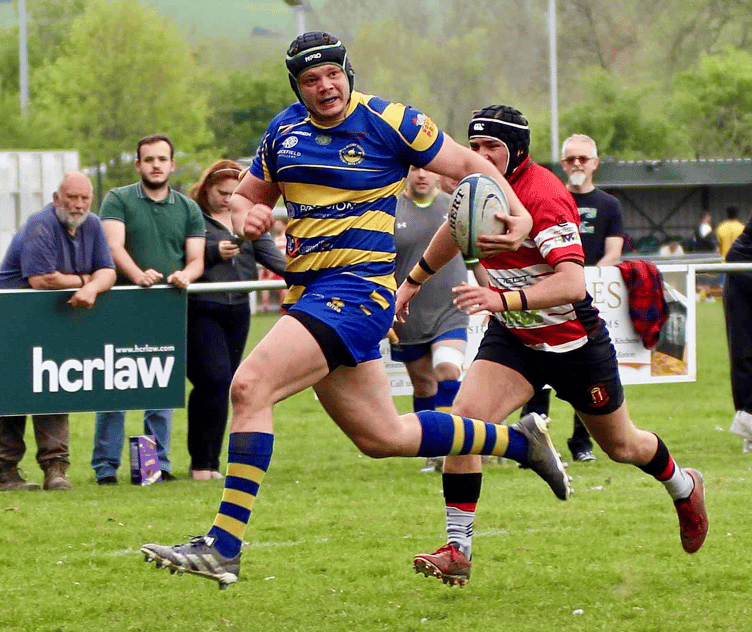 Shaun Hobbs pins back his ears to score the opening Monmouth try