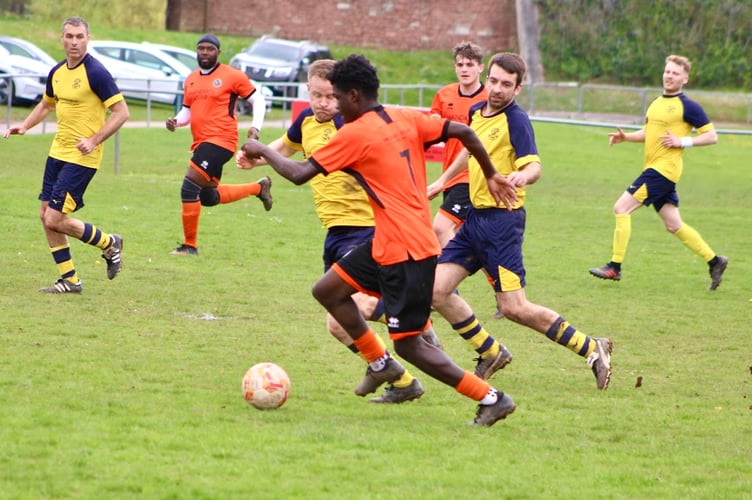 Lamin Ndure launches an attack for the Kingfishers.