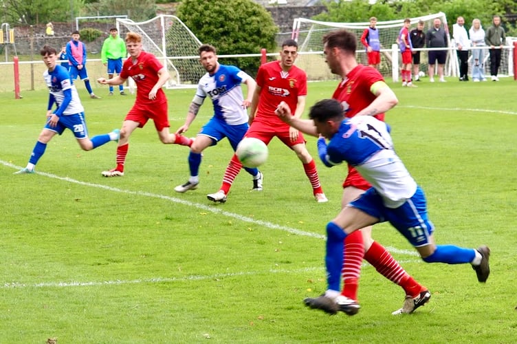 Chepstow players try to get on the end of a cross ball