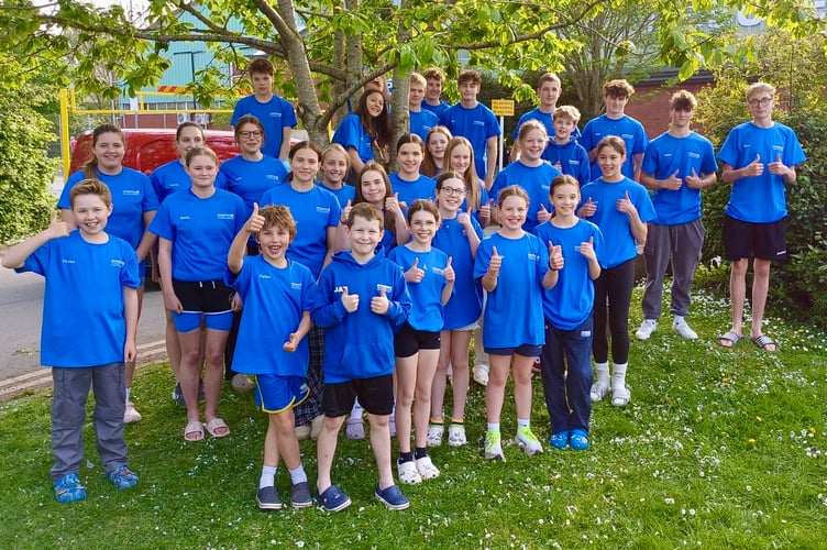 Monnow Swimming Club's team give a big thumbs up after a superb performance