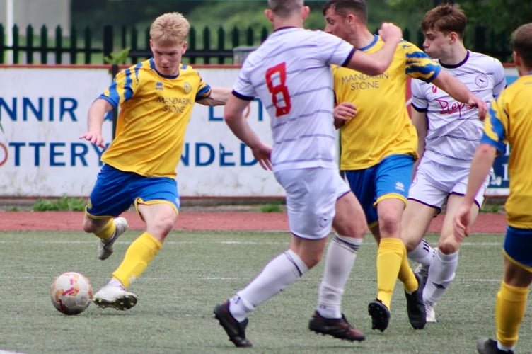A Monmouth player fires in a shot in the 2-2 draw with champions Cwmbran Town