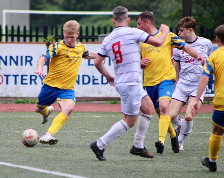 A Monmouth player fires in a shot in the 2-2 draw with champions Cwmbran Town
