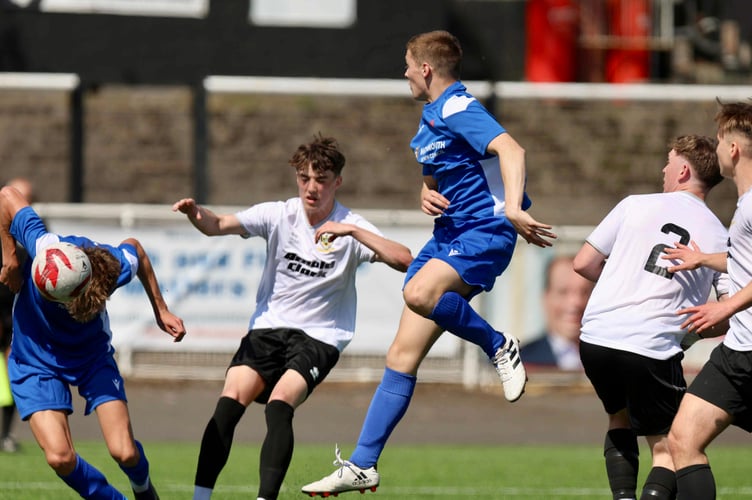Lucas Harris stoops to head Monmouth Comprehensive's second goal in the Welsh Schools cup final