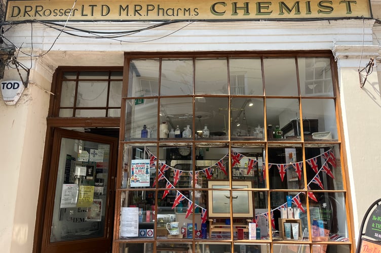Dr Rosser Chemist VE day decorated window display.