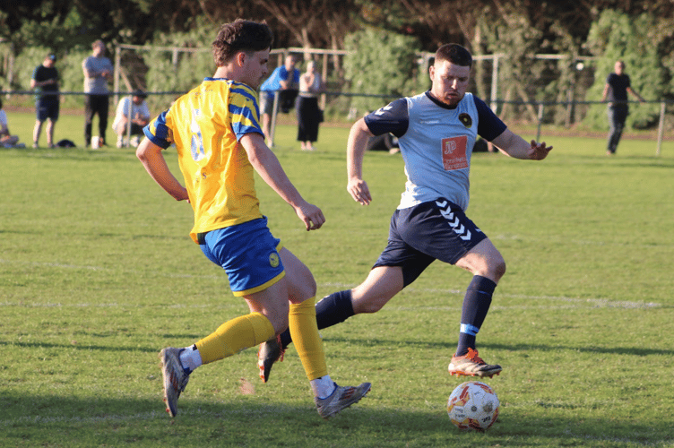 A race for the ball in the Monmouth v Pill game