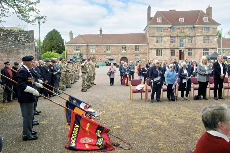 A public service on Parade square saw the Standards lowered for a two minute silence