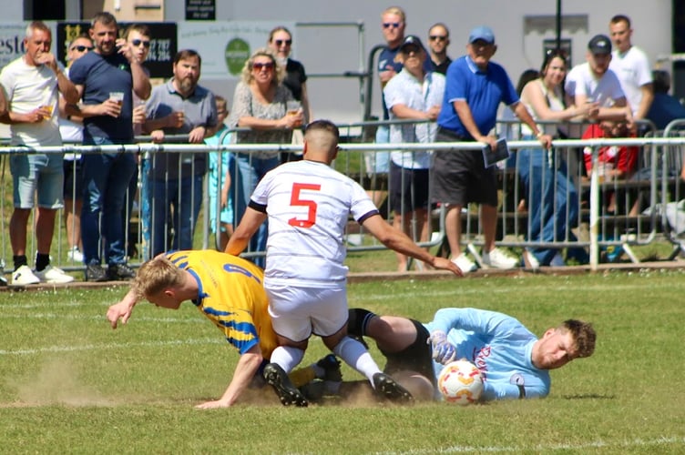 The Crows keeper gratefully grabs the ball as Monmouth pile on the pressure