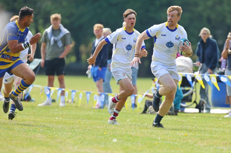 Rob Coe sprints clear for the opening Barbarian try