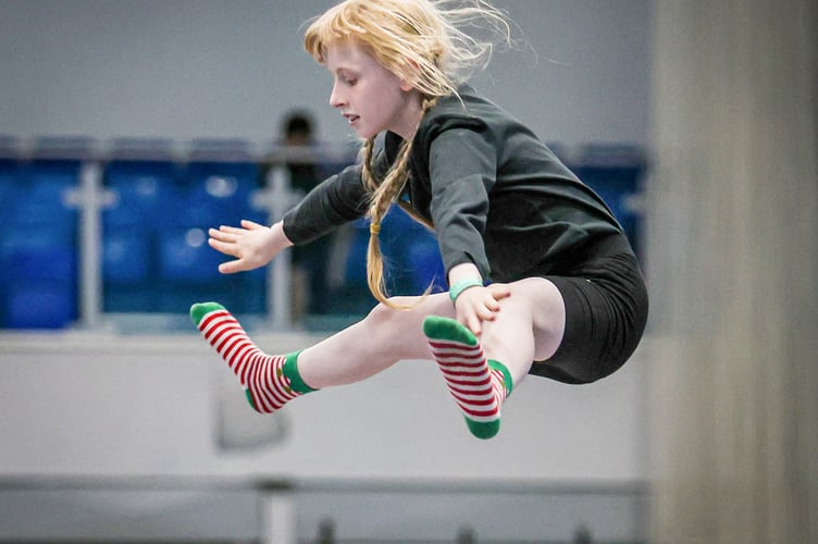  The focus is on gymnasts progressing from basic skills to performing full routines and competing in competitions.