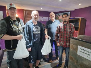 Indian Summer treats Foodbank clients to meals