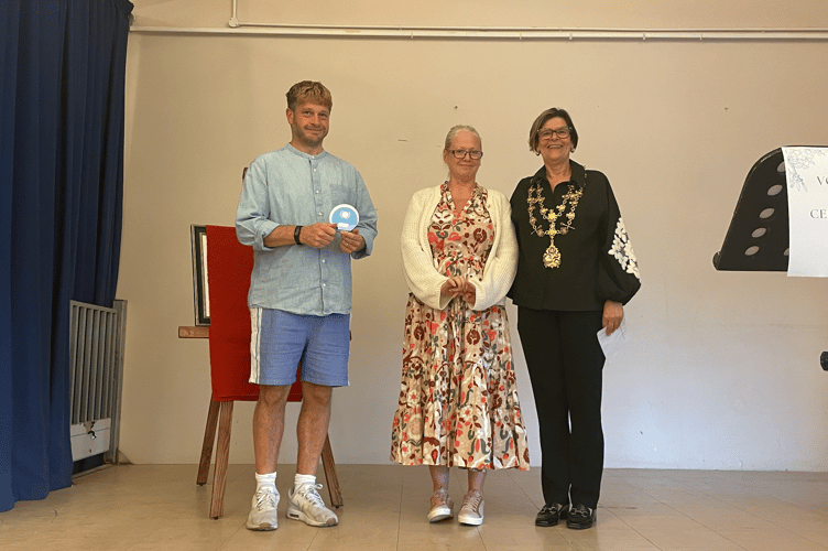 Young volunteer award for Freddie Hughes- collected by his parents