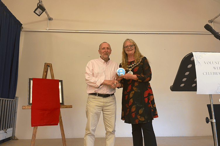 The be-friender volunteer award presented by Maxine Mitchell Mayor of Caldicot to Ros Whitfield but was collected by Paul Harrington.
