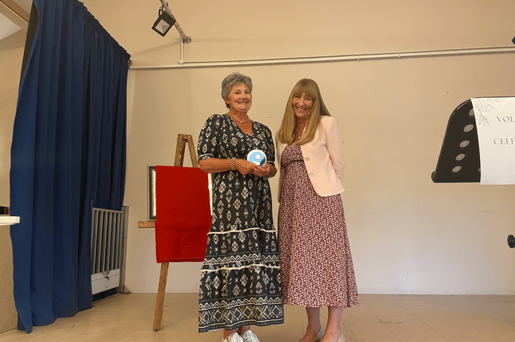Outstanding contribution award was presented by Angela Sandles MCC Cabinet member to Janet Clare-Vass