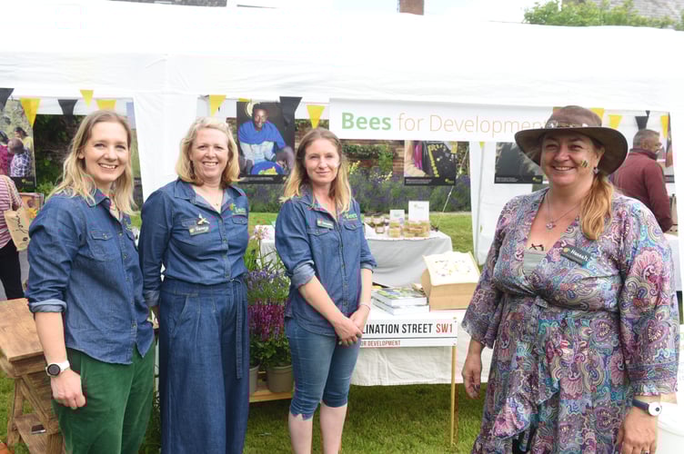 Staff chatting to their new CEO, Hannah Wood (right)