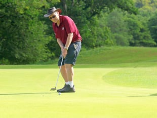 Local school tennis coach completes golf marathon
