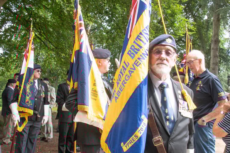 Ron Bennett with the standard of the Abergavenny branch of the British Legion.