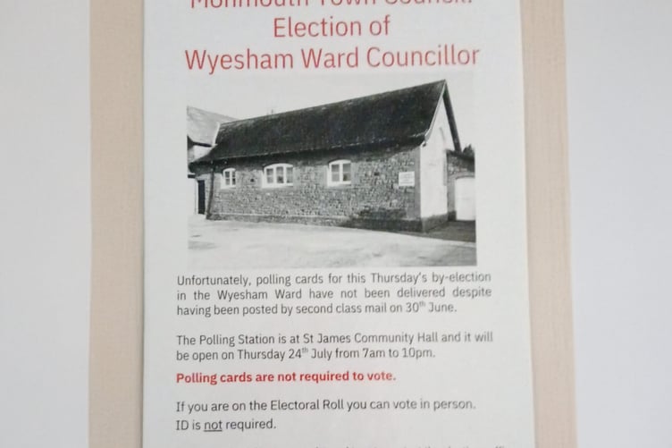 The poster being put up in the Wyesham Ward