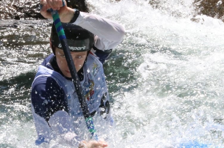 Jake Mitchell powers through the spray