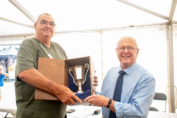 Show president Alan Morgan presented Terry Wheeler with the Sam Blake Cup for the heaviest onion which was about 2lbs 12oz.