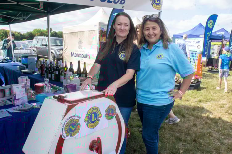 Nadine Axon and Katya Waters with the tambola on the Chepstow and Caldicot Lions stall.