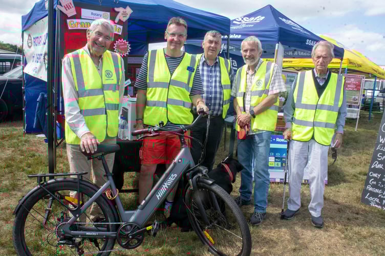 Richard Wickham, Guy Wilson, Chris Rastell, Mac Carty and Bob Civill of Chepstow Rotary with an electric bike which is one of the prizes in their summer draw.