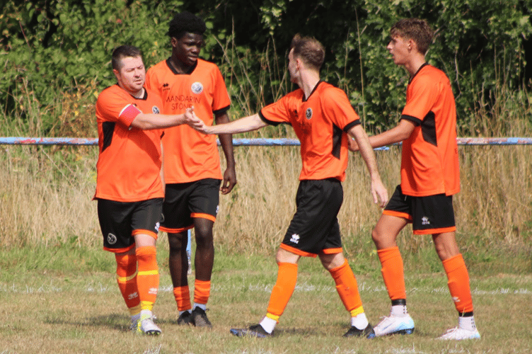 Dan MacDonald is congratulated after scoring