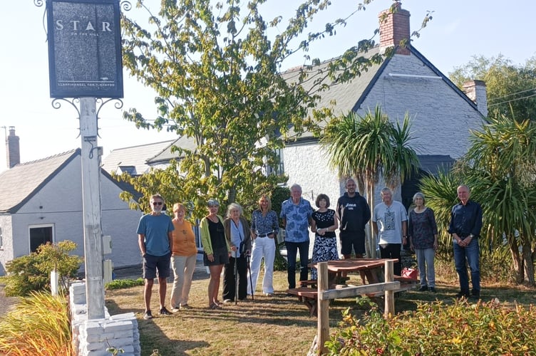Volunteers and new landlord Richard Barker outside The Star, Llanvihangel Tor y Mynydd.


