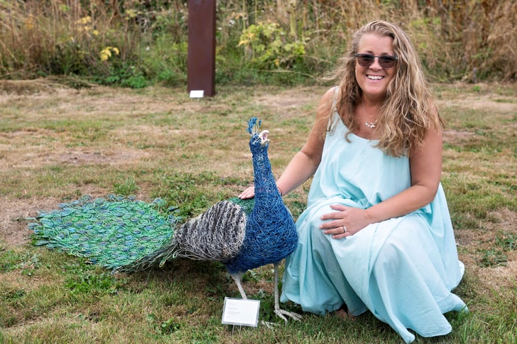 Hayley Jones with her sculpture work done in copper wire