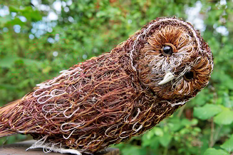 A Barn Owl sculpted out of copper wire