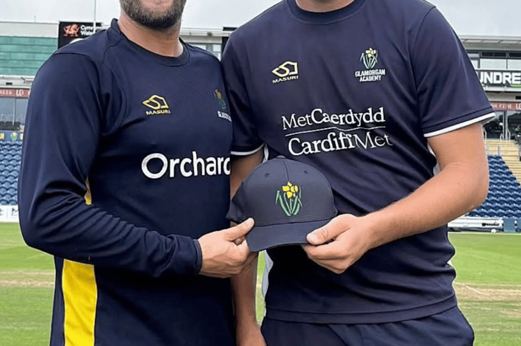Billy Root presents Abergavenny CC's Tom Norton with his Glamorgan cap