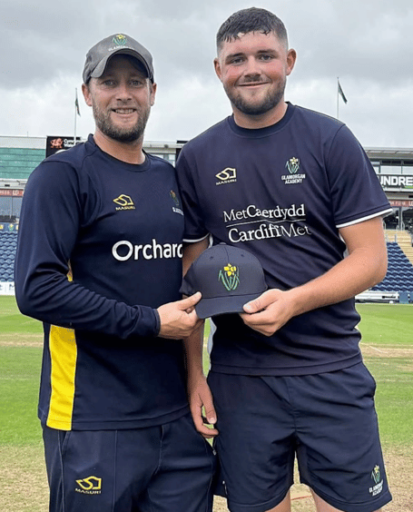 Billy Root presents Abergavenny CC's Tom Norton with his Glamorgan cap