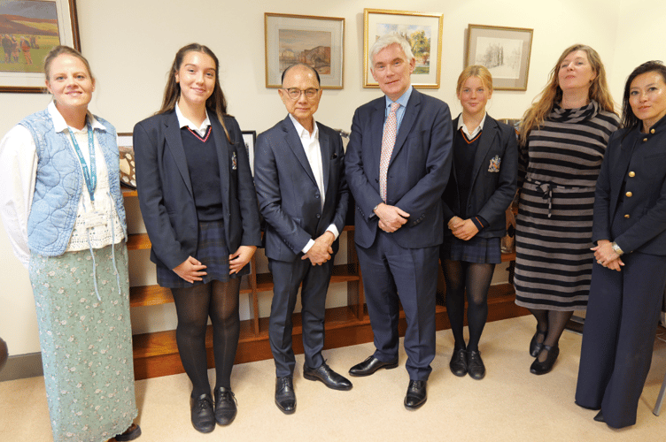 Mrs Nieuwoudt, Izzy T, Professor Jimmy Choo OBE, Mr Melvyn Roffe MBE, Amelia H, Silija Manninen, Lucy Choi (left to right)