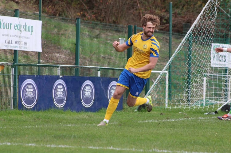 Robbie Atkinson celebrates his goal for Monmouth Town
