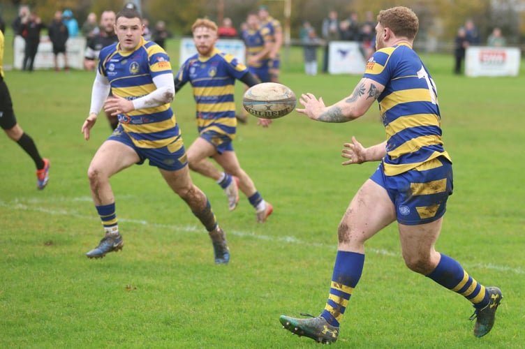 Harry Whelan feeds inside for Lewis Bates to race clear for his fourth try of the season