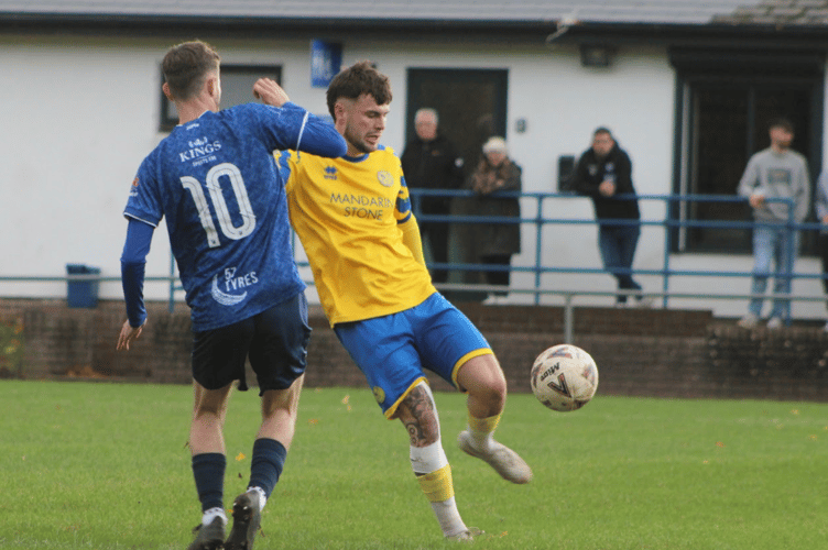 A Monmouth player looks to get the ball forward