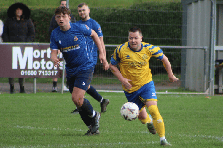 Goalscorer Dan Macdonald on the charge
