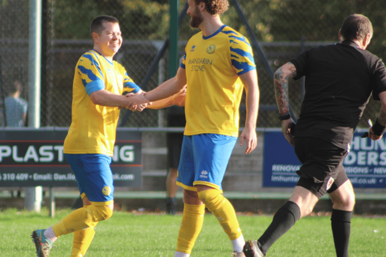 Hat-trick scorer Dan Macdonald is congratulated by a team-mate 