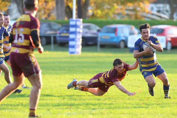 Dan White evades a tackle to jink through for one of hs brace of tries