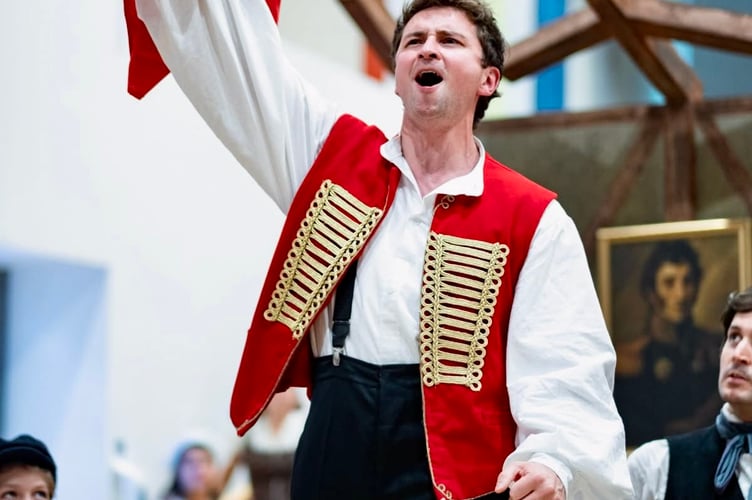 Dominic Callaghan calls the people to the barricades in Les Miserables. Photo: Bristol Amateur Operatic Society