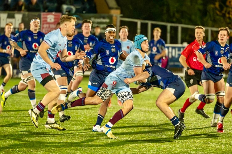 Ollie Park on the charge for the RAF against the Navy. Photos: Gareth Roberts