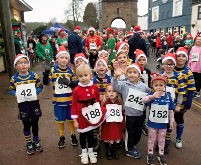 Santas lift the gloomy day with the annual fun run
