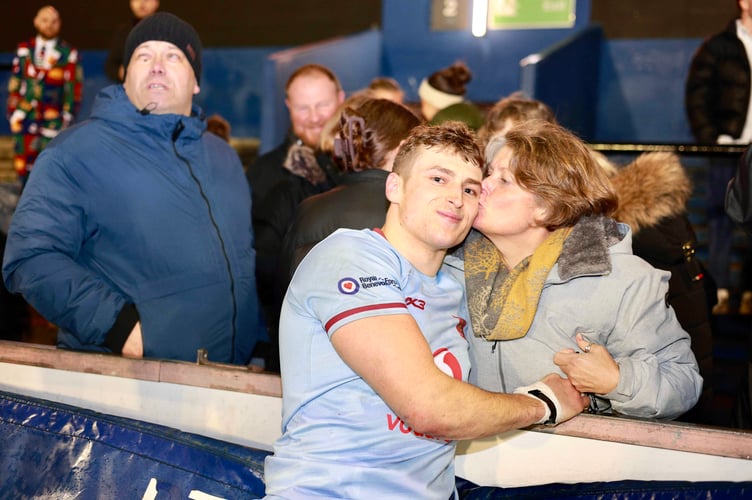 Ollie Park gets a congratulatory kiss after helping the RAF U23 to a first title in 19 years