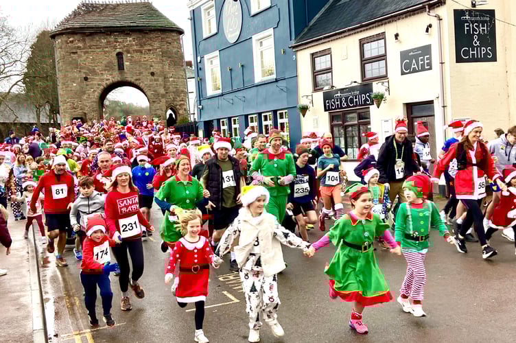The Santa Fun run gets under way at Monnow Bridge. Photo: Nick Hartland
